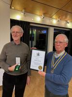 David showing his award to the club